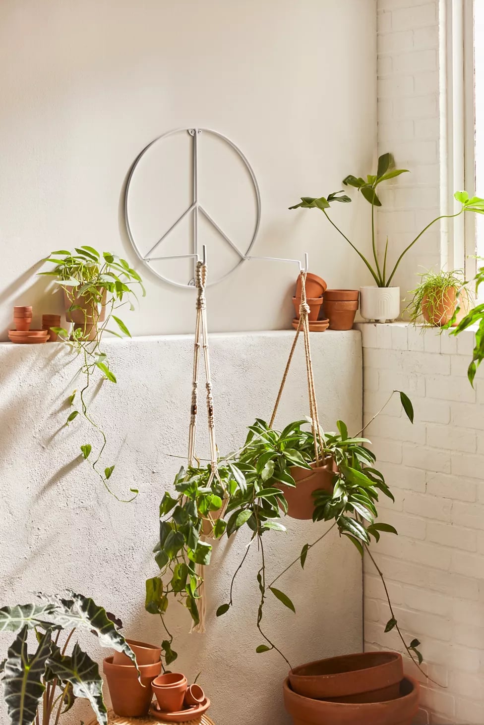 A Plant Hanger: Urban Outfitters Peace Plant Hook, Revamp Your Home With  These Unique Urban Outfitters Products, All Under $100
