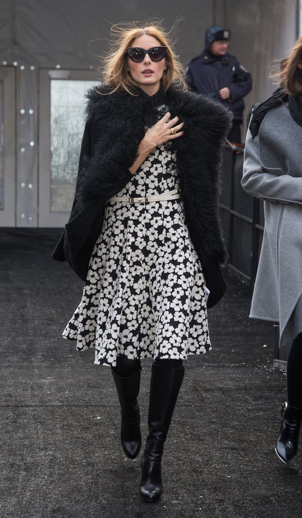 Yes, your favorite Spring dress can work during Winter. Outside the Carolina Herrera show, Olivia added knee-high Christian Louboutin boots and a furry Vince sweater to make her Carolina Herrera dress cold-weather appropriate.