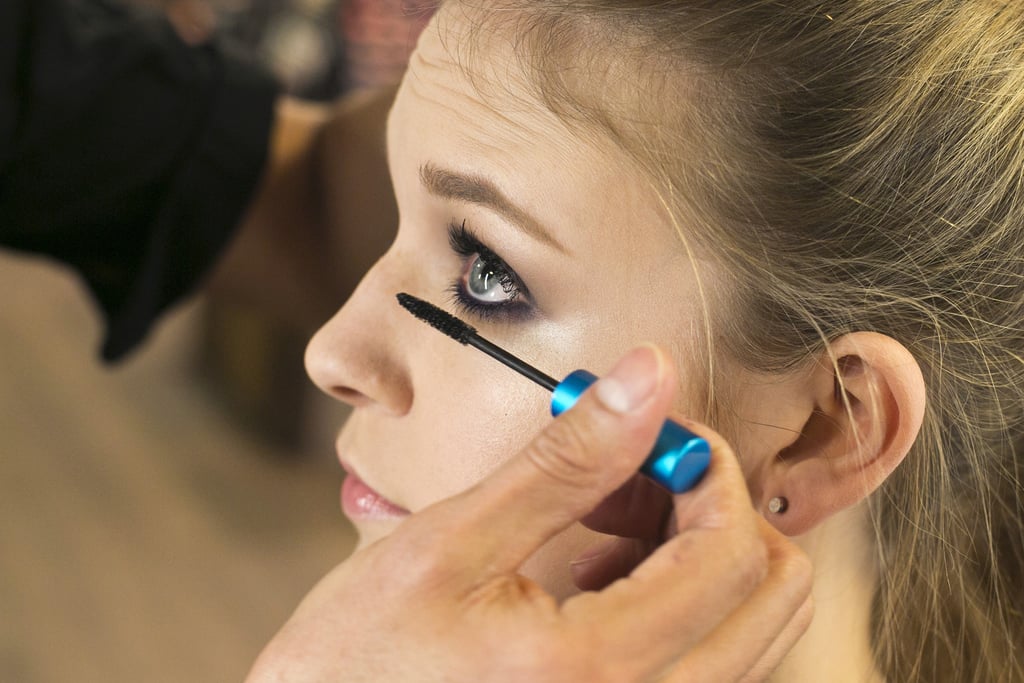 "With the smoky look, you can never have too much mascara," Jennings says. He recommends applying generous coats of mascara to both the upper and lower lashes. "Since we have all this lash and color on top, you get a nice balance of the shadow wrapped around the face, and the bottom lashes get enhanced."