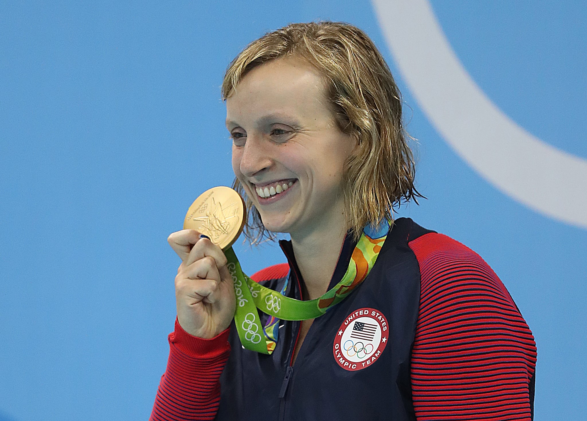 RIO DE JANEIRO, BRAZIL - AUGUST 12: A tearful Katie Ledecky of United States is seen on the podium during her National anthem after the Women's 800m Freestyle final and winning gold on Day 7 of the Rio 2016 Olympic Games at the Olympic Aquatics Stadium on August 12, 2016 in Rio de Janeiro, Brazil. (Photo by Ian MacNicol/Getty Images)