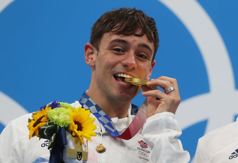 TOKYO, JAPAN - JULY 26: Tom Daley of Team Great Britain poses with the gold medal during the medal presentation for the Men's Synchronised 10m Platform Final on day three of the Tokyo 2020 Olympic Games at Tokyo Aquatics Centre on July 26, 2021 in Tokyo, 