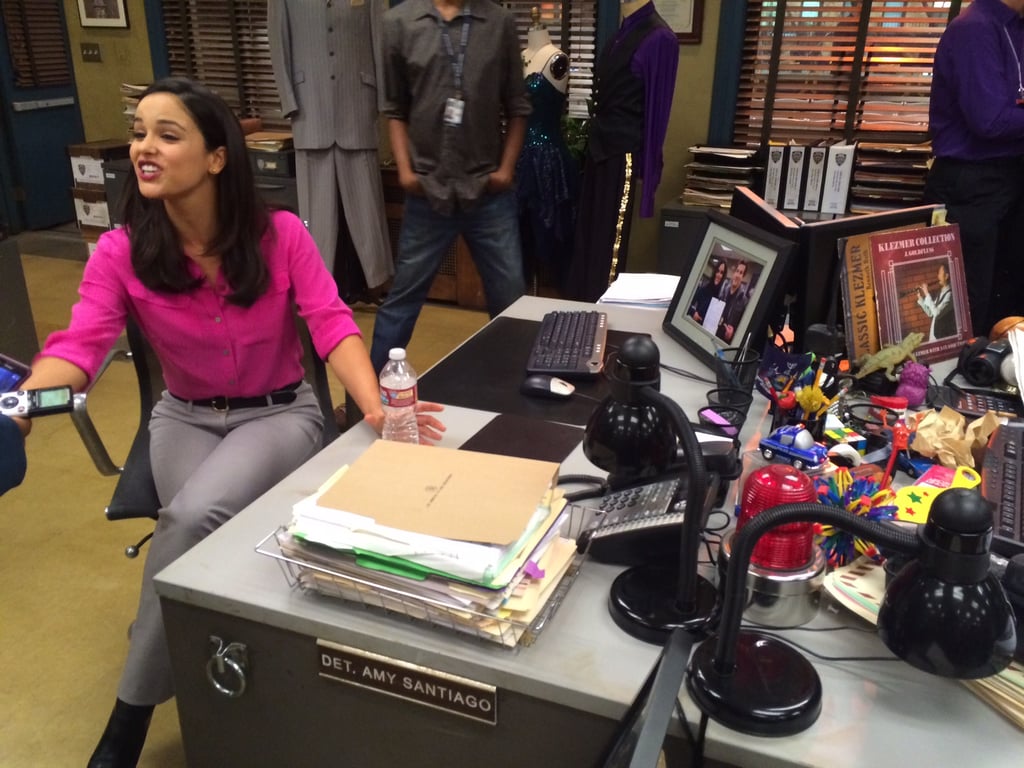 Melissa Fumero, aka Detective Amy Santiago, sat at her desk and answered questions about the show.