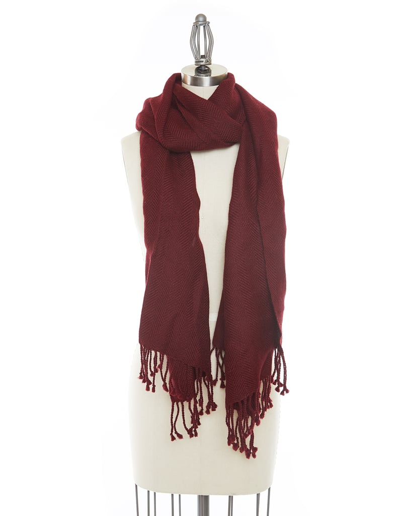 This cozy scarf ($100) is handwoven using soft alpaca and colored using natural dyes.