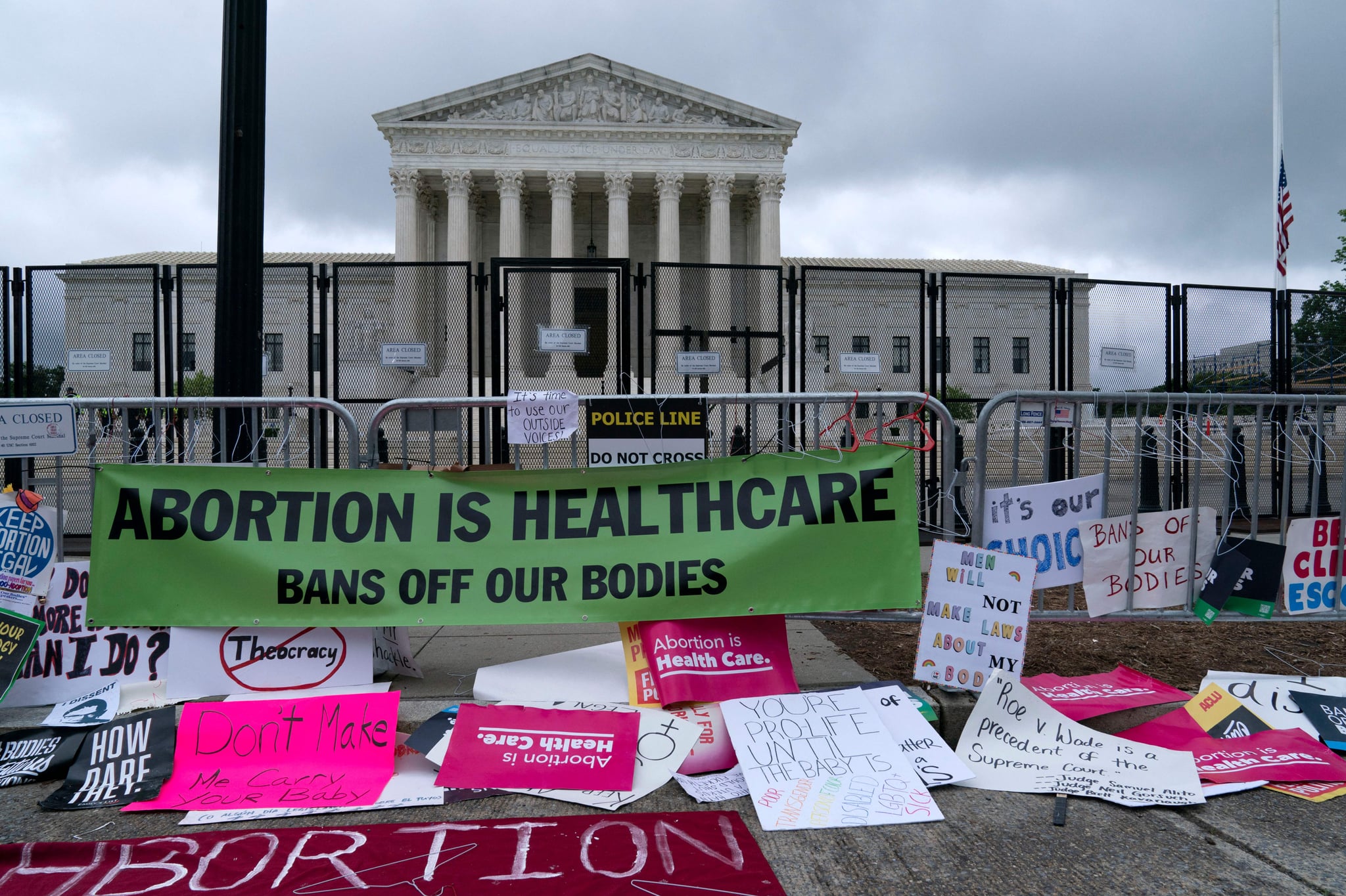 Abortion rights demonstrators leave banners at a fence outside of the US Supreme Court in Washington, DC, May 14, 2022. - Thousands of activists are participating in a national day of action calling for safe and legal access to abortion. The nationwide demonstrations are a response to leaked draft opinion showing the US Supreme Court's conservative majority is considering overturning Roe v. Wade, the 1973 ruling guaranteeing abortion access. (Photo by Jose Luis Magana / AFP) (Photo by JOSE LUIS MAGANA/AFP via Getty Images)