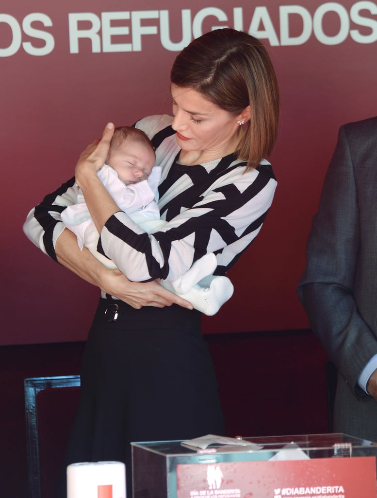Queen Letizia cradled a tiny baby during a fundraising event in October.