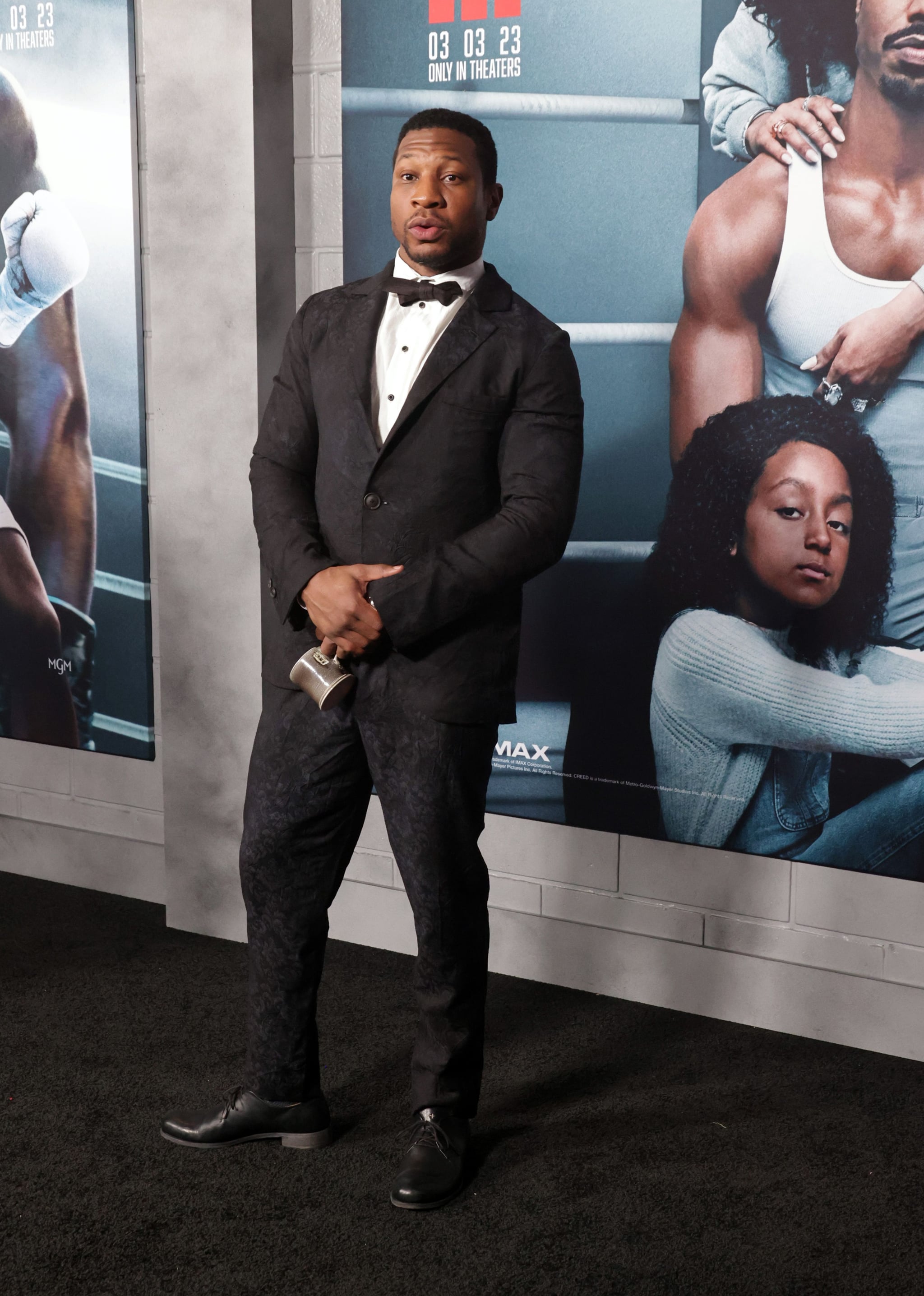 Why Is Jonathan Majors Always Carrying Around a Little Cup?