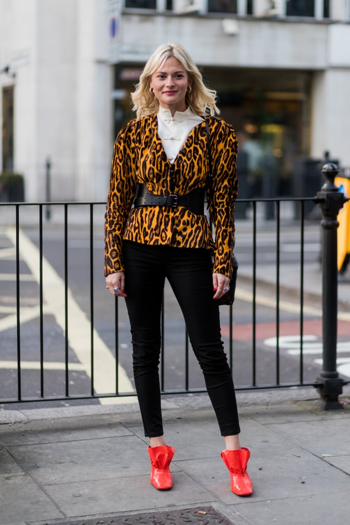 With an animal print blazer and bright mules for a walk on the wild side.