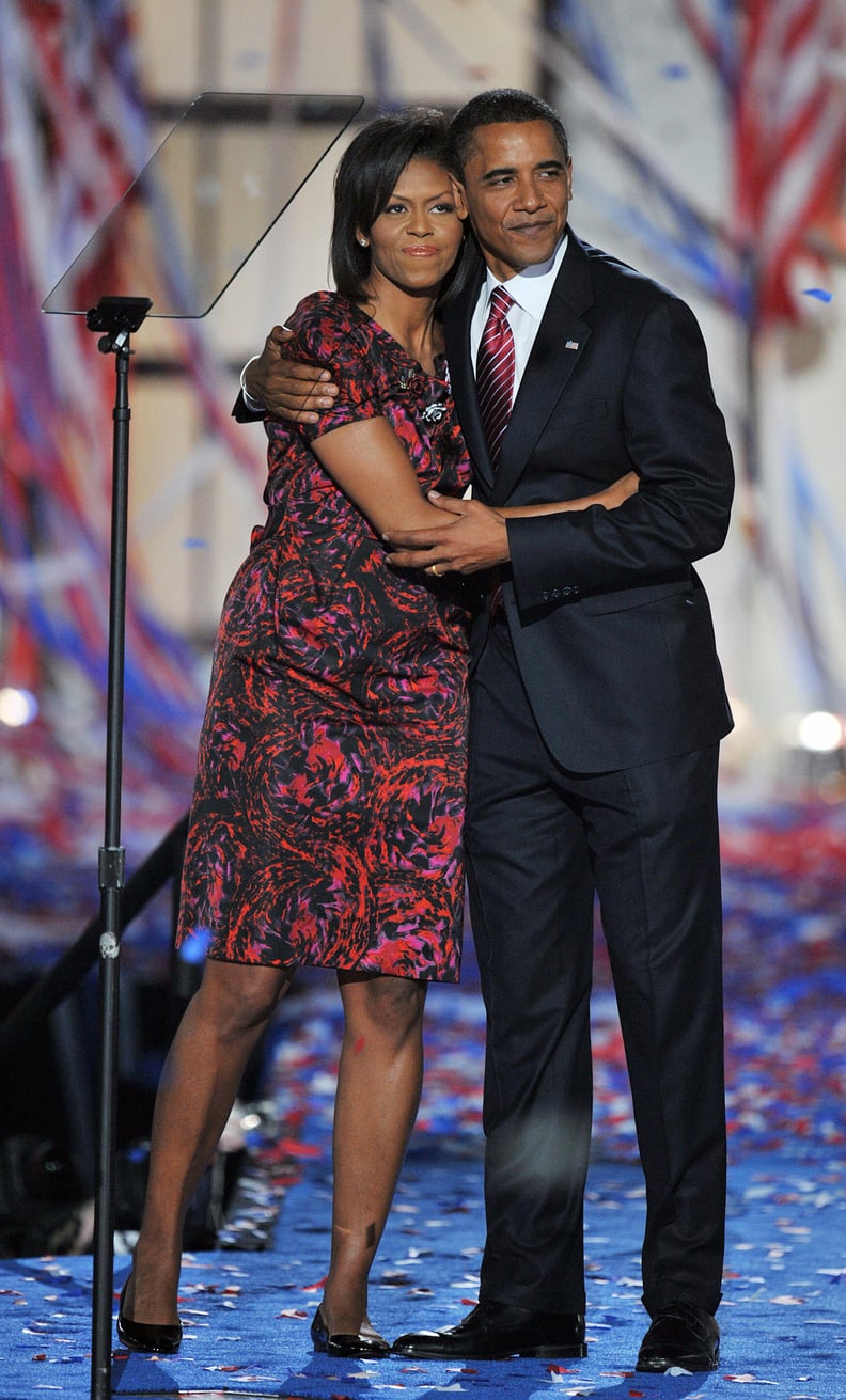 Democratic Presidential candidate Barack Obama hugs his wife Michelle on stage at the end of the Democratic National Convention 2008 at the Invesco Field in Denver, Colorado, on August 28, 2008. The Illinois senator tonight formally accepted his nominatio