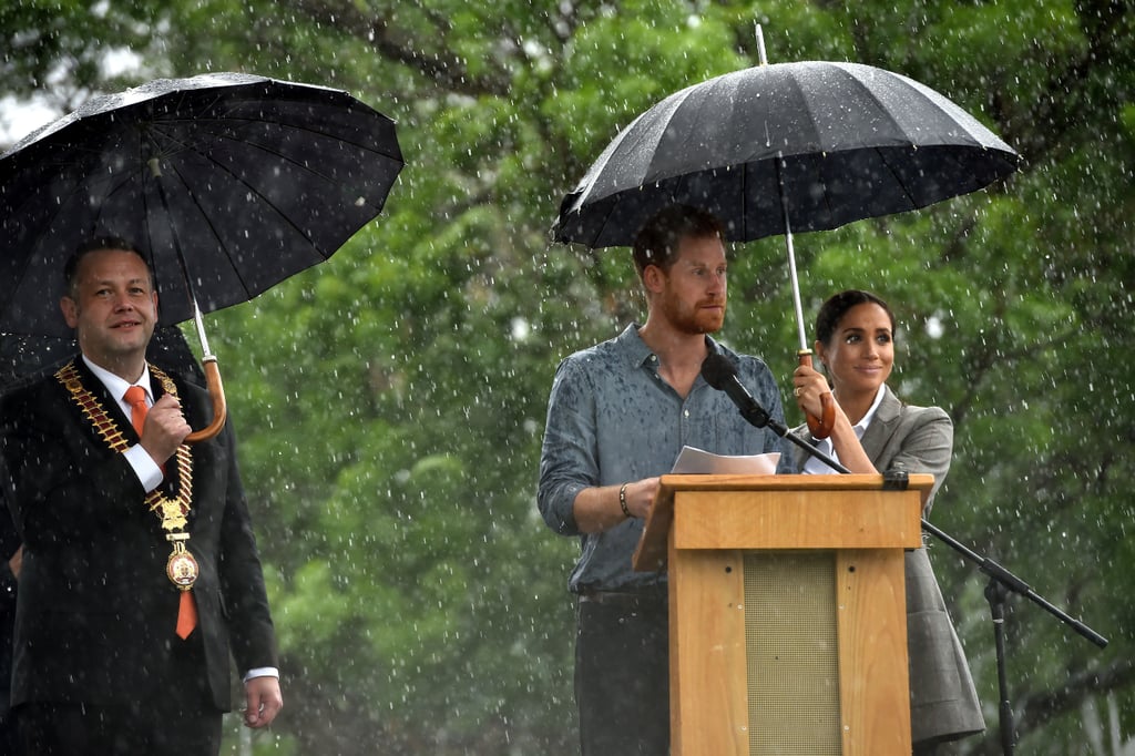 Meghan Markle Holding Prince Harry's Umbrella October 2018