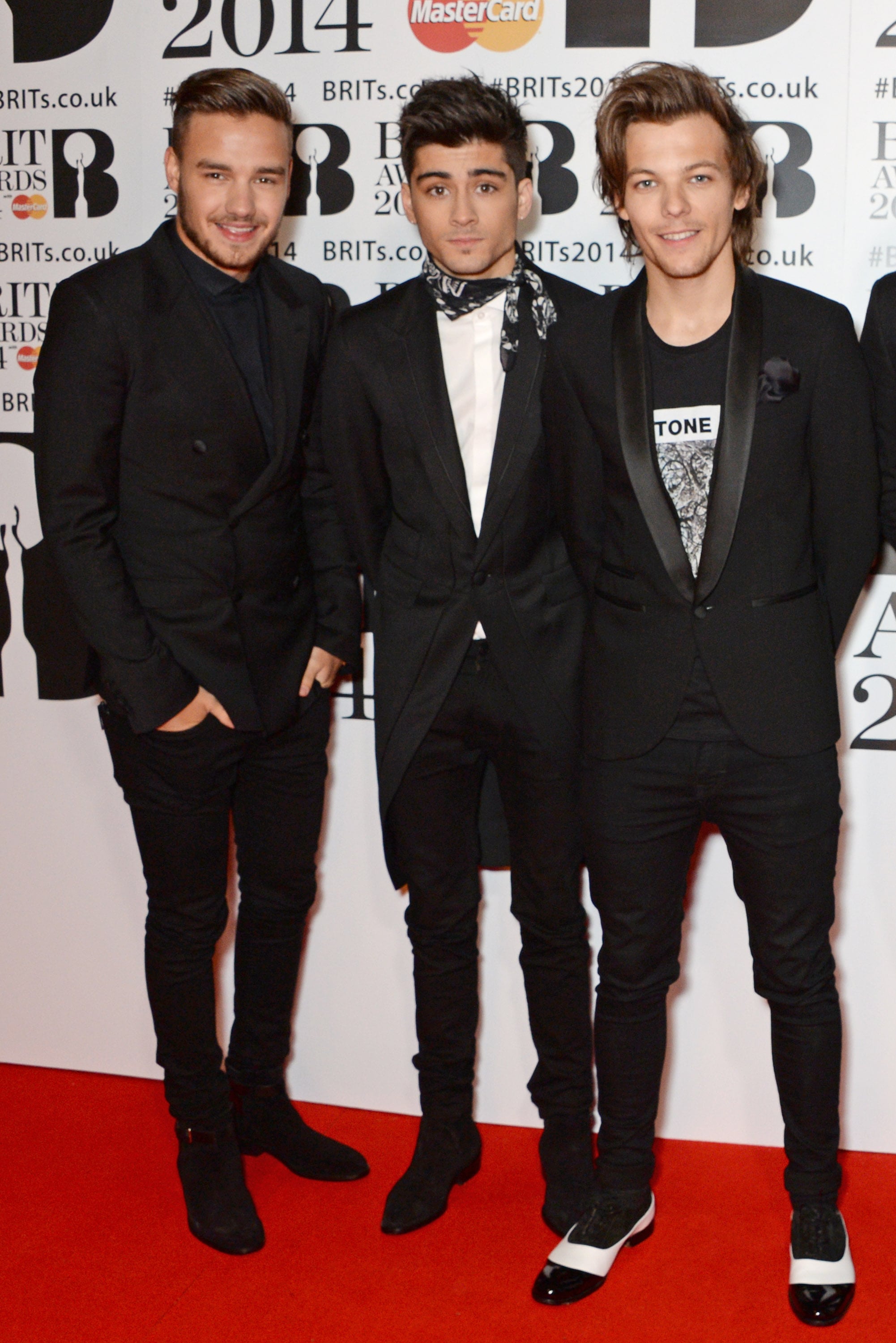 LONDON, ENGLAND - FEBRUARY 19:  (L to R) Liam Payne, Zayn Malik and Louis Tomlinson of One Direction attend The BRIT Awards 2014 at the 02 Arena on February 19, 2014 in London, England.  (Photo by David M. Benett/Getty Images)