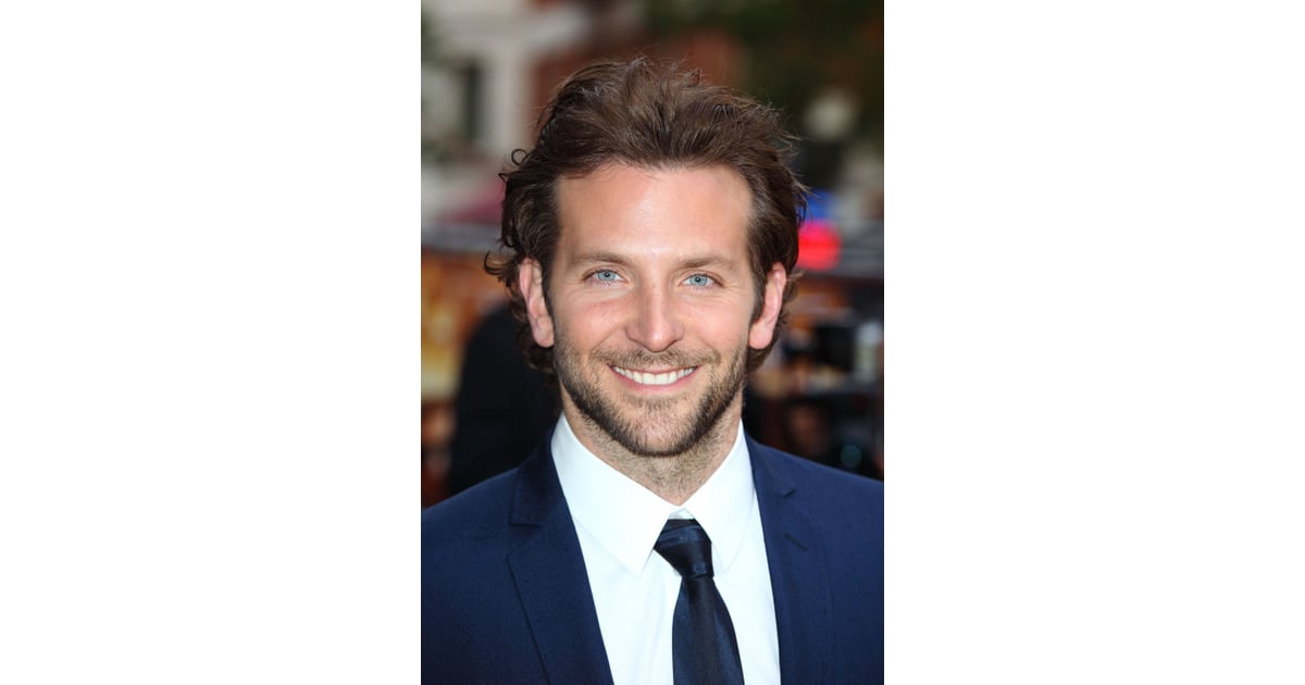 Bradley Cooper cuts a dashing figure in navy suit as he models a