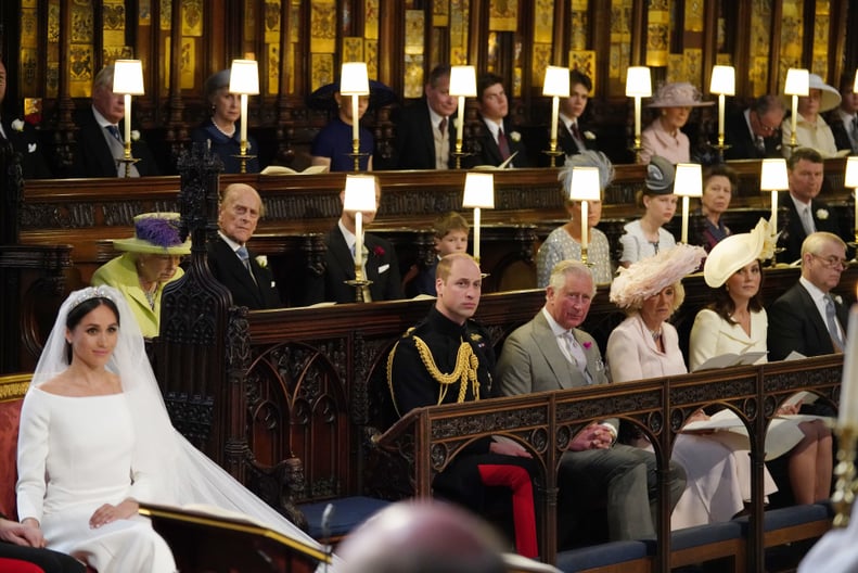 TOPSHOT - US fiancee of Britain's Prince Harry Meghan Markle (L) in St George's Chapel, Windsor Castle for her wedding to Britain's Prince Harry, Duke of Sussex, watched by (middle row L-R) Britain's Queen Elizabeth II, Britain's Prince Philip, Duke of Ed