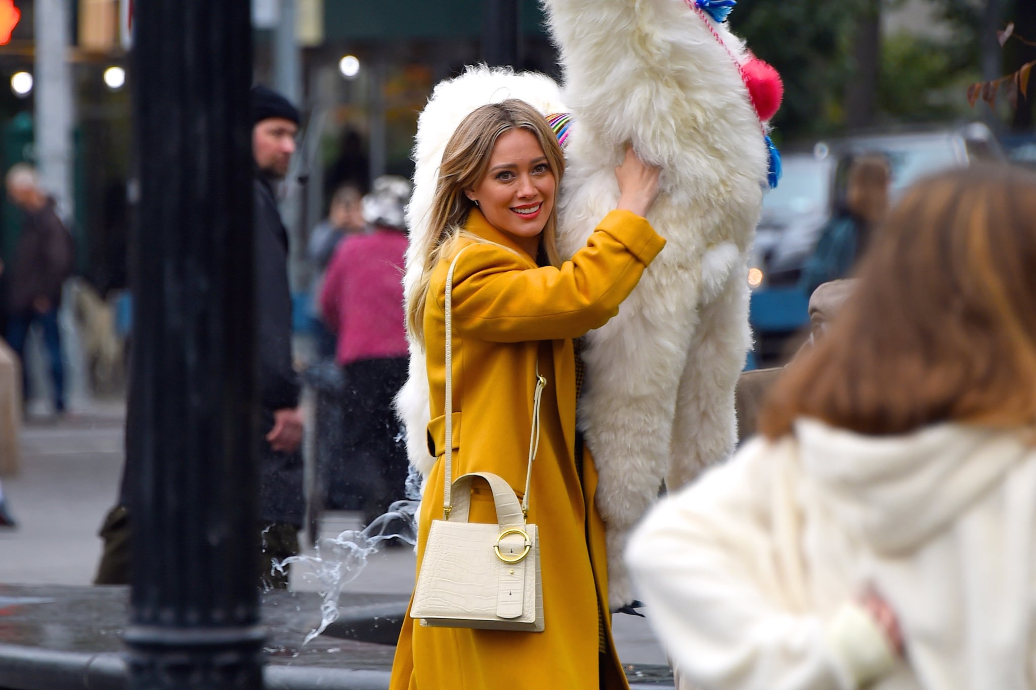 NEW YORK, NY - OCTOBER 29:  Hilary Duff seen with a stuffed animal llama at a film set at Washington Square Park on  October 29, 2019 in New York City.  (Photo by Robert Kamau/GC Images)