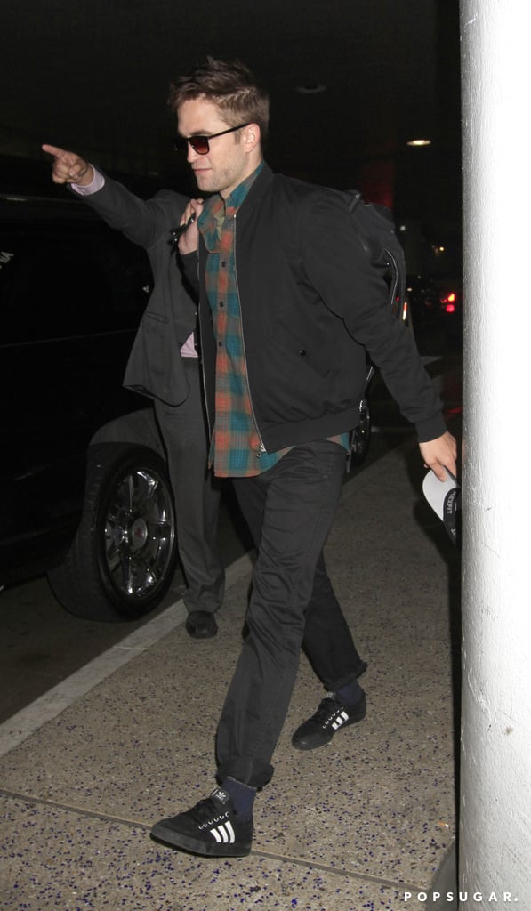 Robert Pattinson looked casual as he walked through LAX on Thursday.