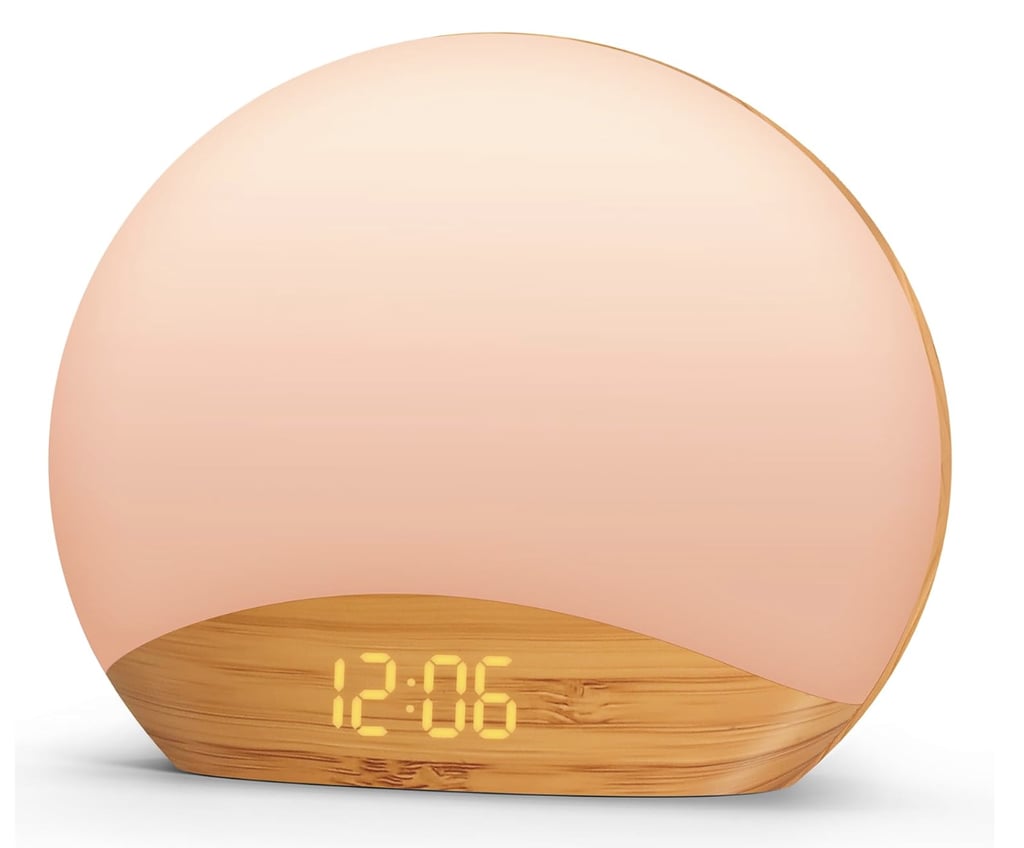 Reacher Wood Grain Sunrise Alarm Clock ($33, originally $50)
For a more wellness-minded group, I'd gift this sunrise alarm clock. It mimics the sunrise to help its recipient gently ease out of bed in the morning, and has 26 gentle sleep sounds to help them doze off at night.