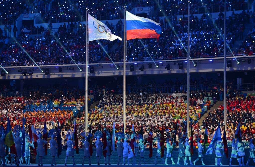 The Russian flag waved beside the Olympic flag.