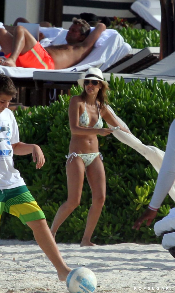 She Wore a Floral-Print White Two-Piece With Dark Sunglasses and a Fedora in Mexico