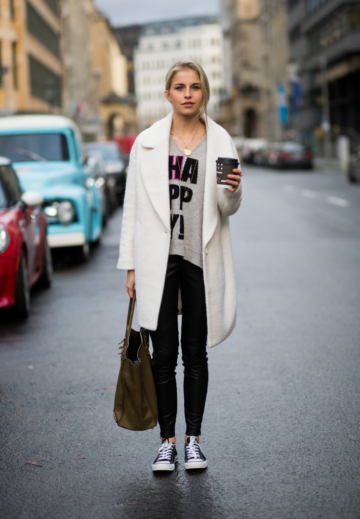 With a Slogan Tee, a Duster Coat, and Black Skinny Jeans