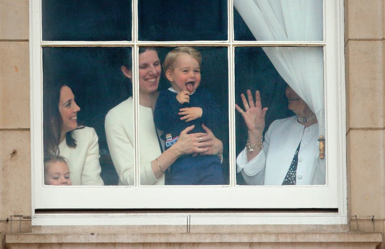 LONDON, UNITED KINGDOM - JUNE 13: (EMBARGOED FOR PUBLICATION IN UK NEWSPAPERS UNTIL 48 HOURS AFTER CREATE DATE AND TIME) Prince George of Cambridge being held up at a window of Buckingham Palace by his nanny  Maria Teresa Turrion Borrallo to watch Troopin