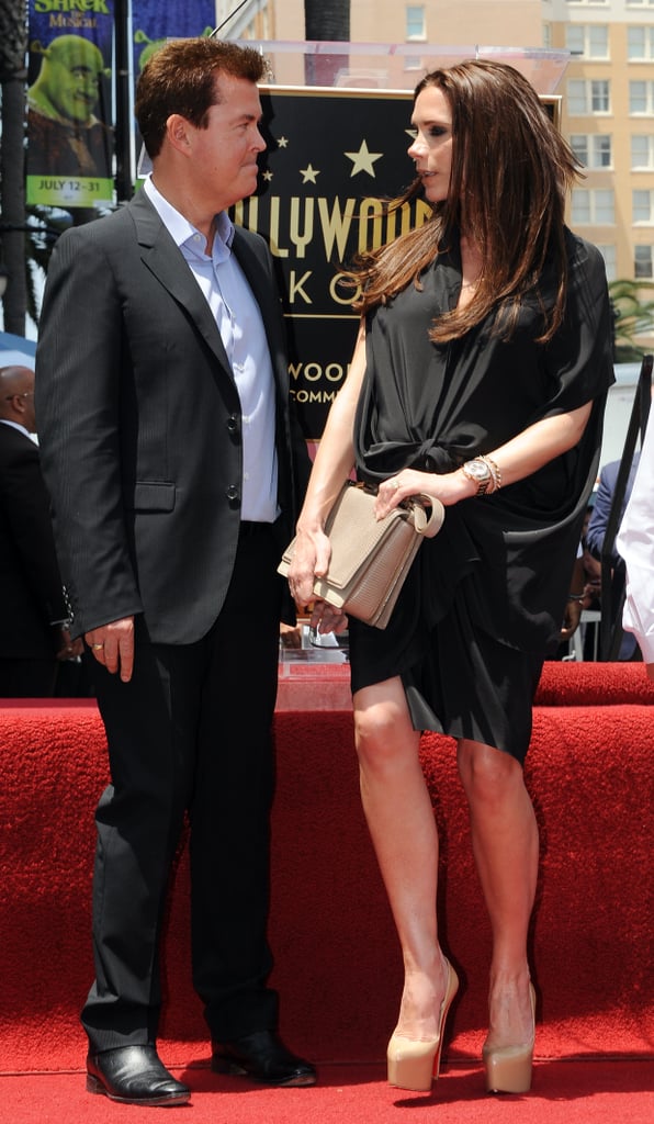 Victoria in a gathered maternity dress at a Hollywood Walk of Fame ceremony in 2011.