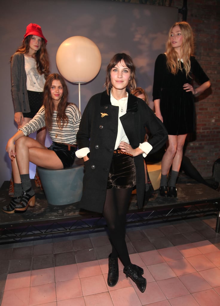 >> Last night's launch presentation of Alexa Chung's Madewell collection at the Bowery Hotel Terrace brought out interested parties in droves.  Alexa, in short velvet shorts and white safari shirt from the first collection, involved as many of her friends as possible — Poppy Delevigne and Pixie Geldof were on modeling duty, Tennessee Thomas DJed, and Daisy Lowe mingled with the crowd.
The models, replete in cardigans, striped shirts, and Peter Pan-collared dresses, were arranged in tableaus — on a bench, leaning on a retro bicycle, surrounded by vintage suitcases. "It's actually a bit weird to see everyone walking around in the clothes today because they all look like me," Chung said of her designs. "It's a very egotistical exercise."
She doesn't know if the collaboration is a one-time thing — “We haven’t really discussed another [collection] yet but it would be amazing to do" — but she definitely had a hand in the design process — one look at the clothes makes that obvious. "[But] I can't take credit for the hard work at all because I just took sketches in and talked about them," she said.  And not all of her sketches made the final cut: "There was one weird leotard — a denim thing — I tried to push on Kin. I was thinking in my head that I could make a stage outfit for a lead singer but it ended up looking like a weird circus child."
The collection hits Madewell stores in August. So is she sticking around in New York, or headed back to London, now that she's done with her MTV gig? "I don’t really know. My rent doesn’t end til June."