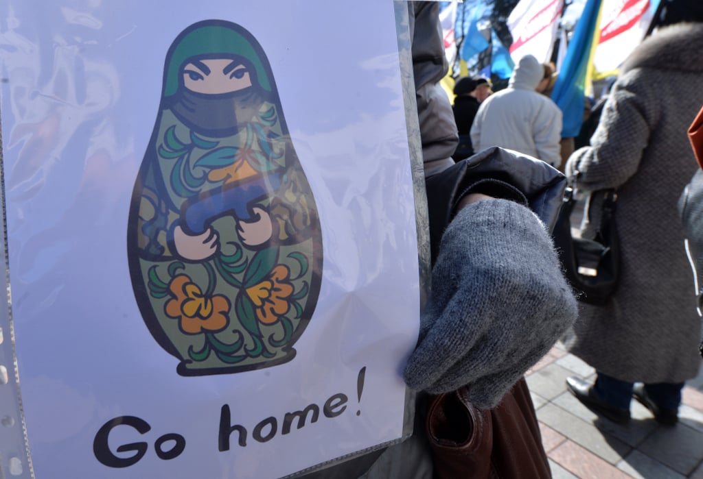 But obviously, not everyone was happy about the results. In Kiev on Monday, a woman held a sign telling Russia to go home, as Ukraine's defense minister said Ukrainian troops would remain in the peninsula.