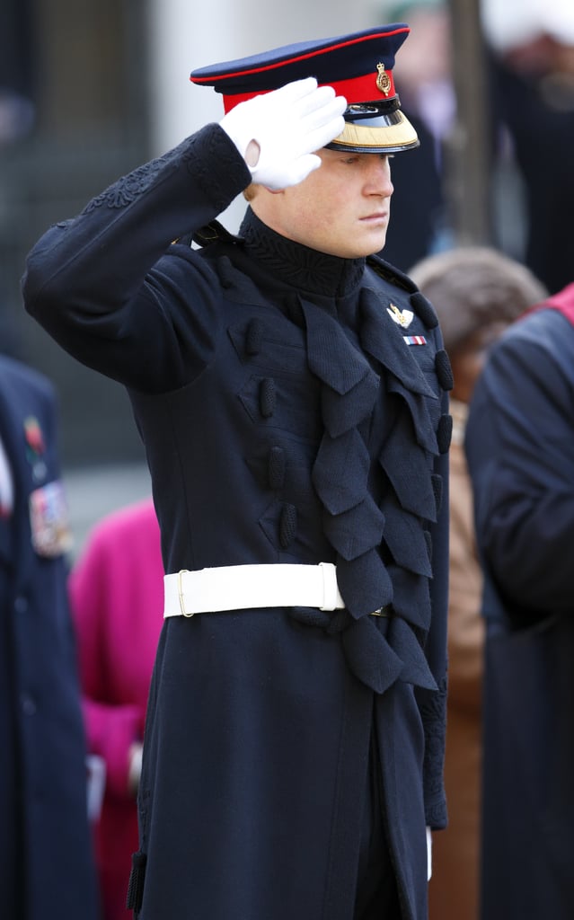 Prince Harry slipped into his uniform for a visit to Westminster Abbey's Field of Remembrance on Thursday in London.