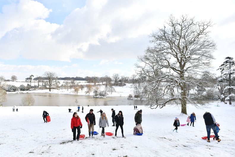 People go sledging in Dunorlan park in Tunbridge Wells following a heavy snowfall on February 27, 2018.A blast of Siberian weather sent temperatures plunging across much of Europe on Tuesday, causing headaches for travellers and leading to several deaths 