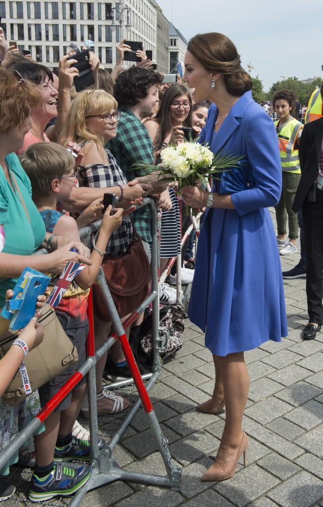 The duchess looks noticeably taller than many well wishers in Berlin.