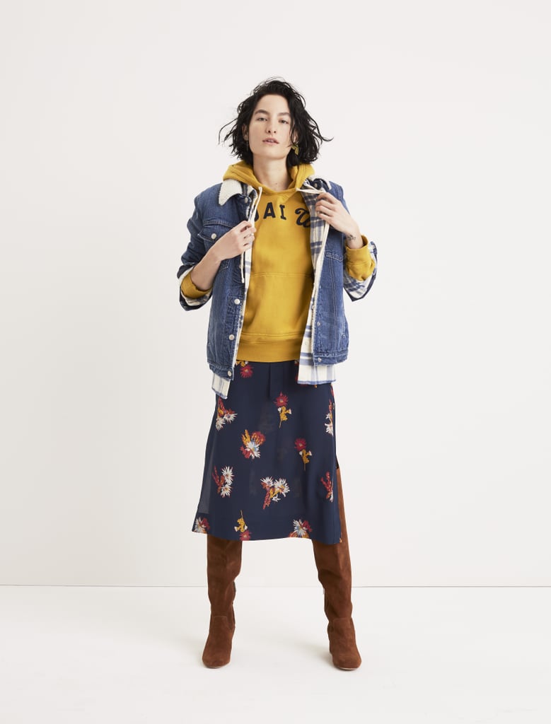 The hoodie and denim jacket give this floral skirt a back-to-school vibe.