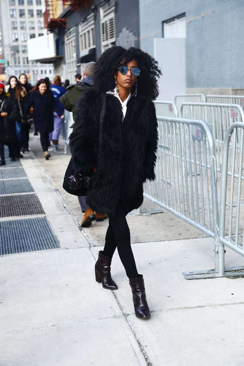 With a statement faux fur jacket and heeled ankle booties to dress things up.