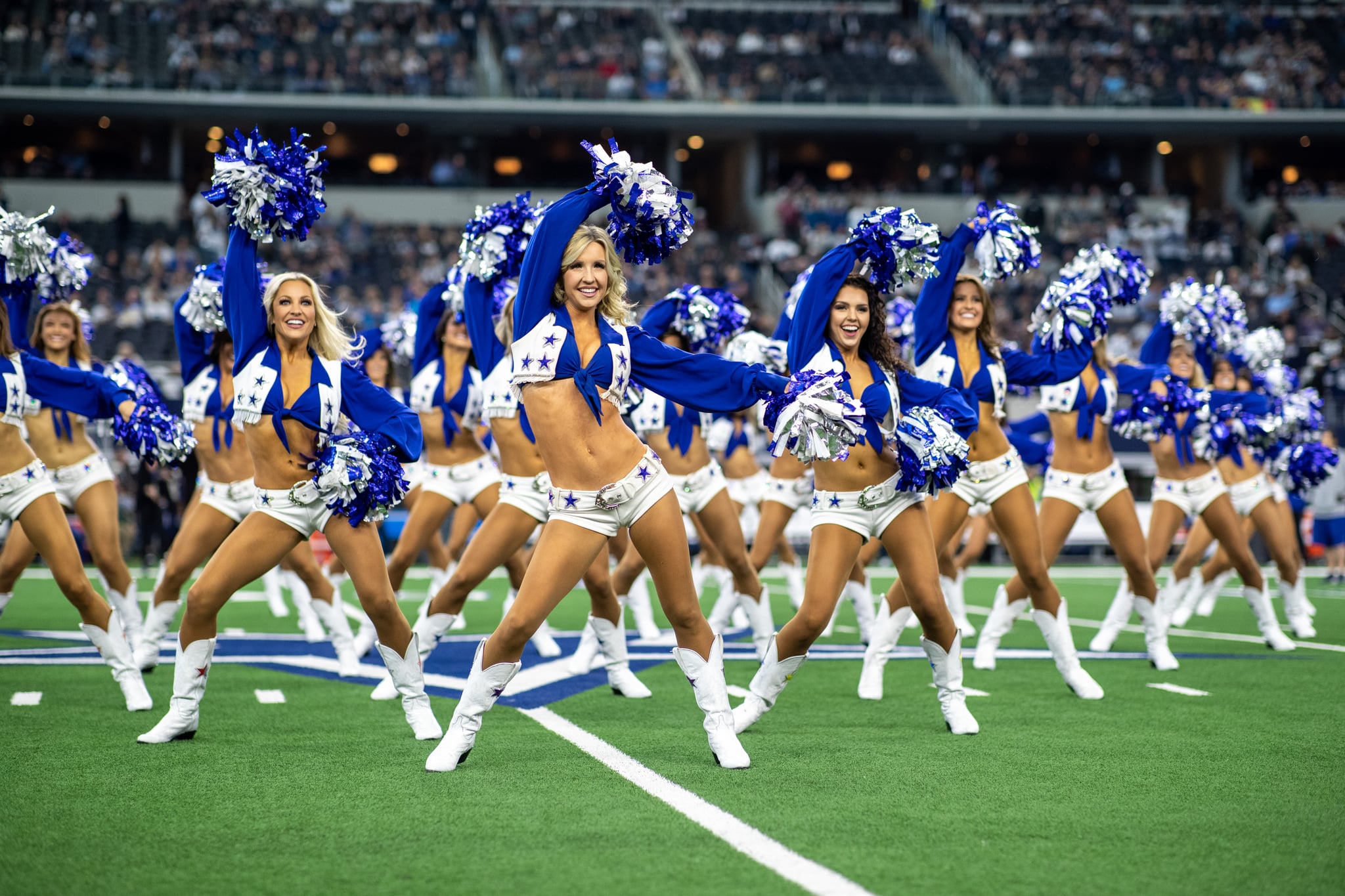 The Dallas Cowboys Cheerleaders cheer during an NFL regular season football game between the Dallas Cowboys and the Los Angeles Rams on Sunday, Dec. 15, 2019 Arlington, Texas. The Cowboys won, 44-21. (Photo by Tom Hauck/Getty Images)