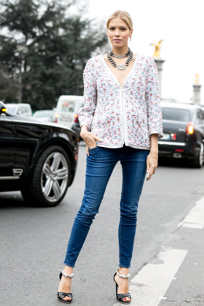 Elena Perminova's modern formula for updating the cardigan? Add skinny jeans and statement jewels.