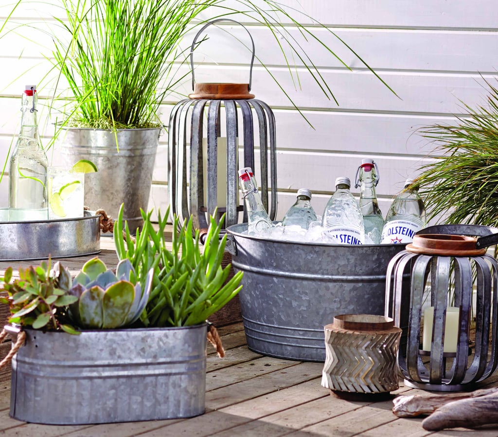 Nothing says Summer like pulling an ice-cold beverage out of a galvanized party tub ($17). Continue the theme with galvanized metal strip lanterns (from $30).