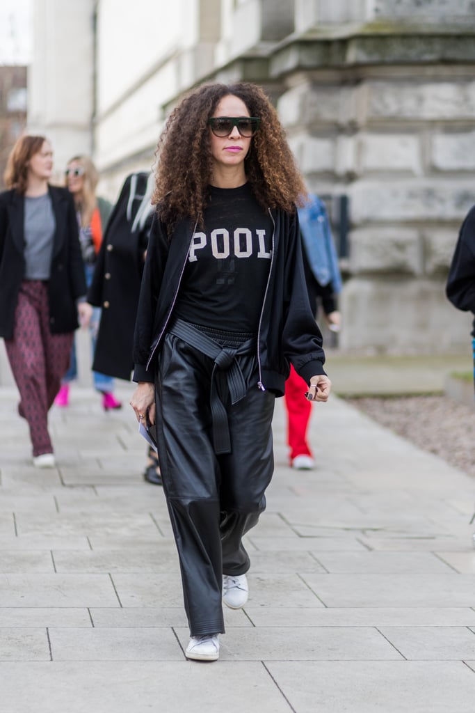 Create an All-Black Look With a Graphic or Team Tee and Leather Pants