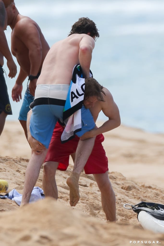 Charlie Hunnam and Garrett Hedlund Wrestle in Hawaii Photos