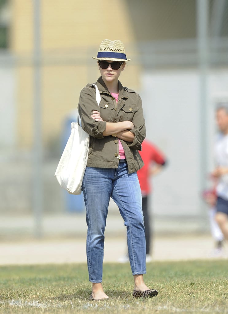 Sideline style: fedora, anorak, boyfriend jeans, and leopard flats.