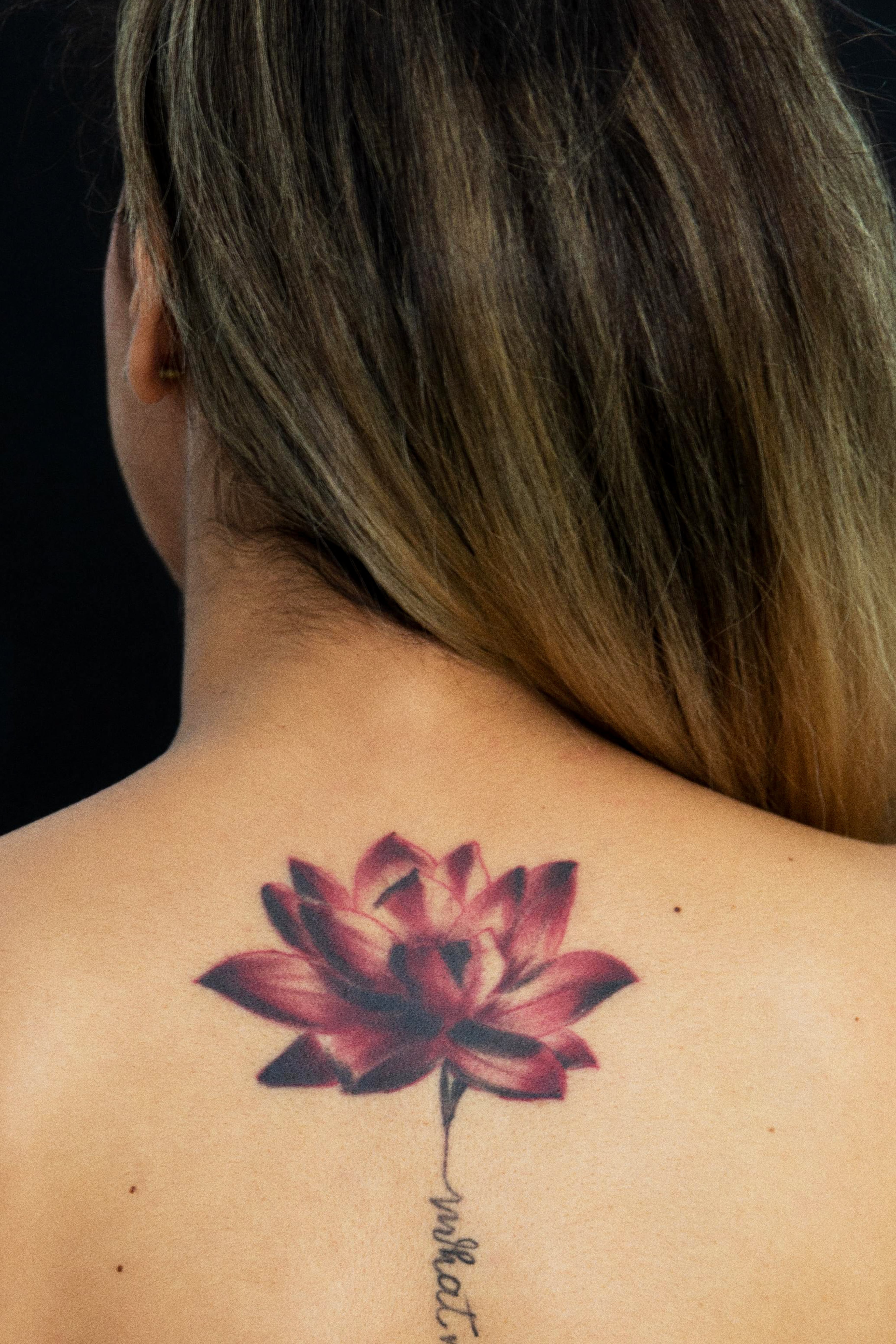Beautiful Woman with a Lotus Flower Bare Shoulders and Beauty