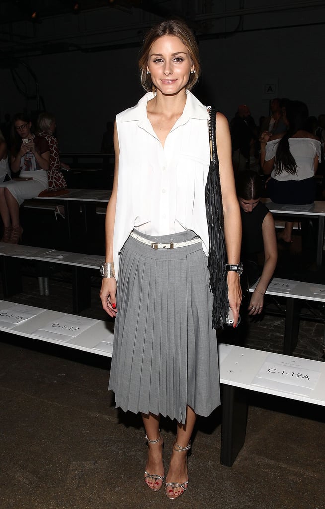 Olivia sported pleated separates — gray tailored Tibi culottes and a crisp white blouse — at the Tibi Spring 2015 show.