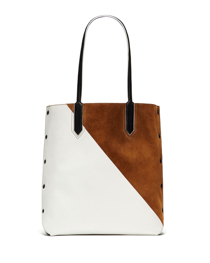 Though the two-toned pattern on this Elizabeth and James tote ($595) makes a statement, it’s still a decidedly neutral addition to my wardrobe — and I need a new satchel that will fit my laptop!
— SW