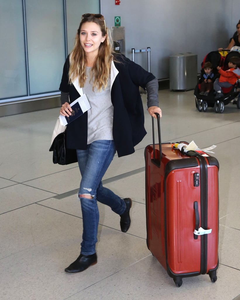 Elizabeth Olsen also arrived in Toronto looking comfy in ripped denim and an oversize jacket.