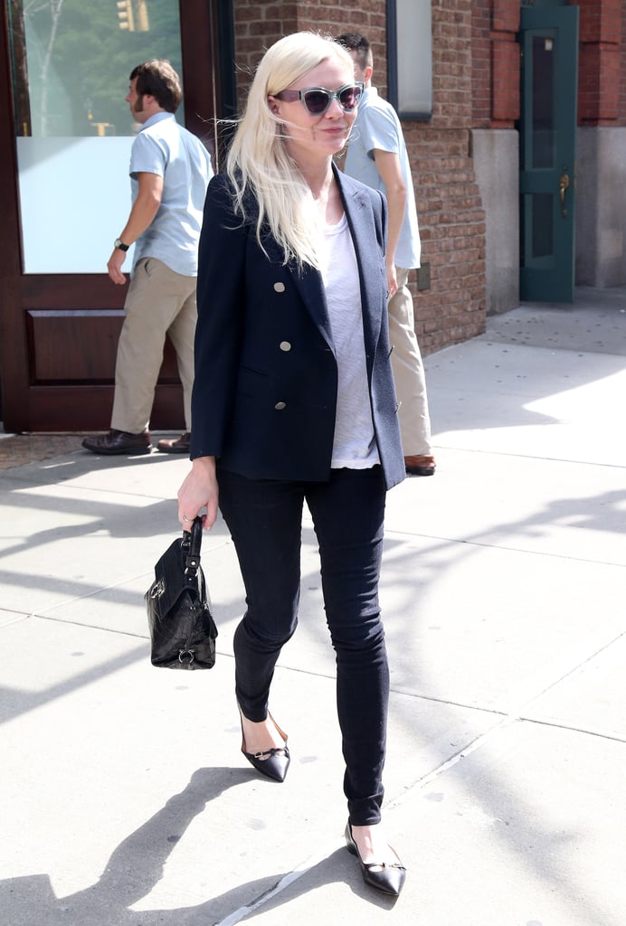 Kirsten has a knack for fashioning an effortless look from minimal pieces — and this look is no exception. She chose a burnout tee, black skinnies, pointed-toe flats, and a leather bag, and then she threw her tailored, miracle blazer on top. With that, she becomes instantly chic. Oh, and like we said before, those two-toned cat-eye shades don’t hurt, either.