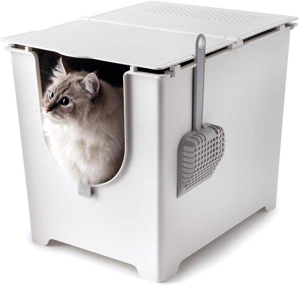 Modkat Flip Litter Box ($100)
"I've had cats my entire life, so I've seen many different litter boxes in my day. I've also tried out plenty of automatic, self-cleaning litter boxes, which definitely have their pros, don't get me wrong. However, the cleanest, most spacious, and convenient litter box for me has consistently been my Modkat flip, which allows for three different lid positions and comes with liners that can be reused for a long time if you're consistent about cleaning daily. 
As great as it is to not have to clean daily when you have an automatic self-cleaner, I will say that I think the smell buildup in the trash gets pretty gnarly, and with a standard box like this, that can be completely avoided. Modkat has gotten my vote for years, and I still have yet to discover a brand that will change that!" — SW