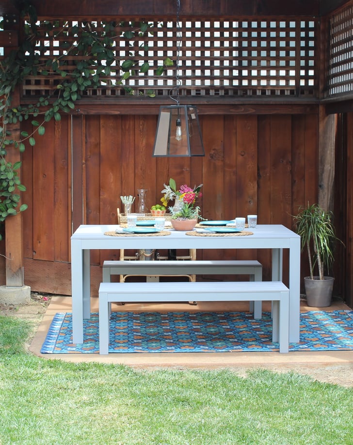 Tip #2: Introduce Pattern With Rugs 
Nothing draws the eye like a beautiful, bold rug — especially when the rest of the outdoor space is fairly minimal. World Market has so many vibrant options, but this Barcelona-inspired version ($150) mimics the intricacy of Spanish tiles. If you yearn for the look of gorgeous, graphic tile but can't splurge on the renovation cost, this is the next best thing!