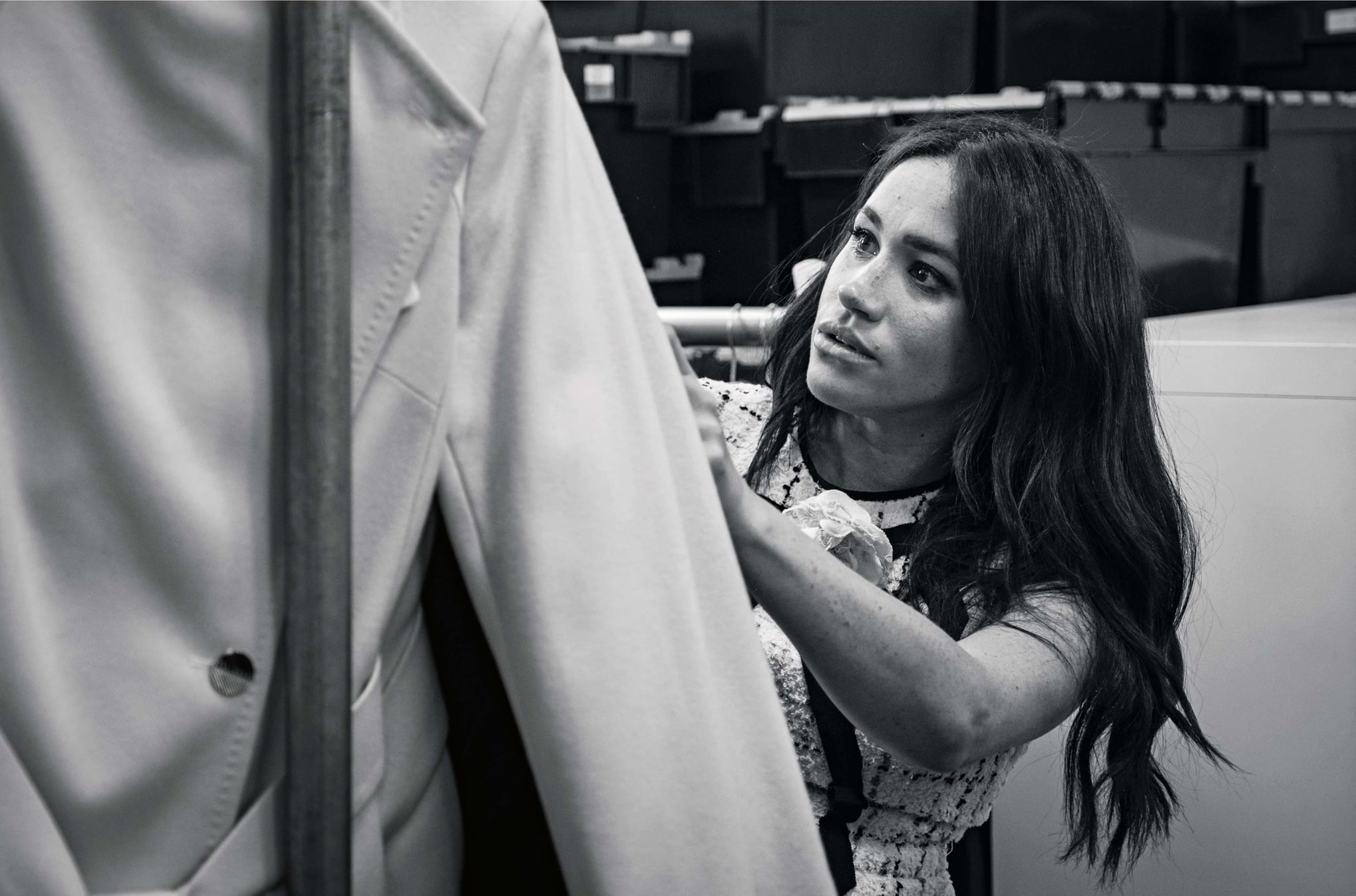 This undated handout photo issued on July 28, 2019 by Kensington Palace shows Britain's Meghan, Duchess of Sussex, Patron of Smart Works, in the workroom of the Smart Works London office. - Prince Harry's wife Meghan will guest edit the September issue of iconic fashion magazine British Vogue, which will see her in 