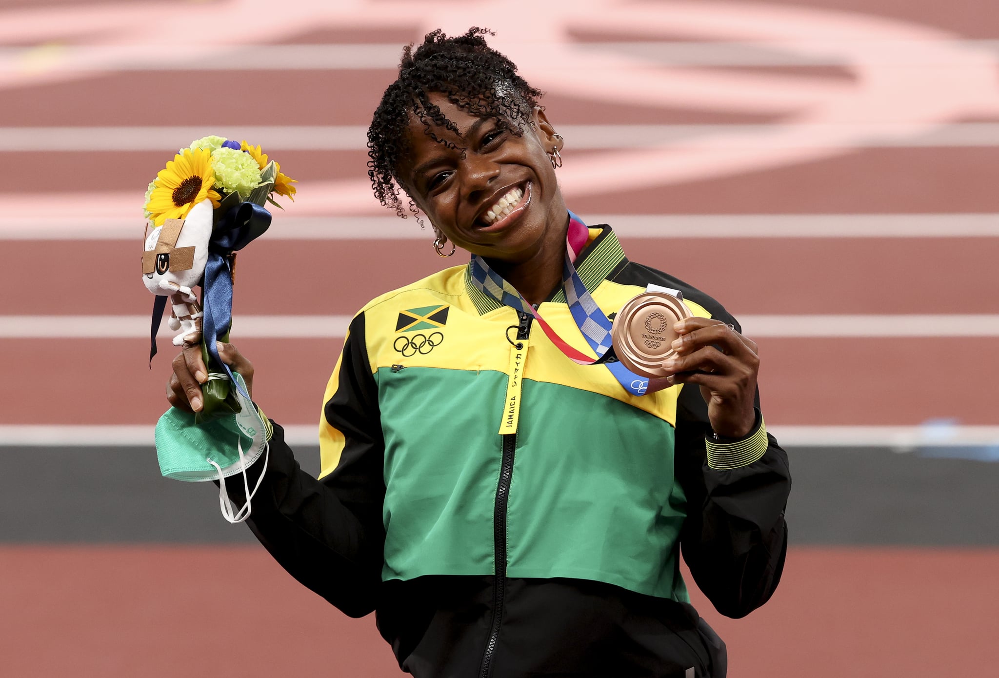 TOKYO, JAPAN - AUGUST 2: Bronze Medalist Megan Tapper of Jamaica during the medal ceremony of the Women's 100m Hurdles on day ten of the athletics events of the Tokyo 2020 Olympic Games at Olympic Stadium on August 2, 2021 in Tokyo, Japan. (Photo by Jean Catuffe/Getty Images)