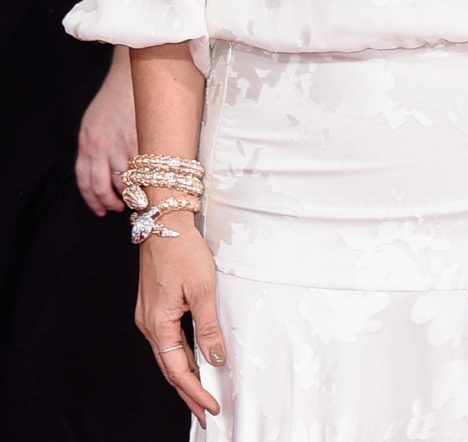 Kristen Wiig armed herself with a wrist full of Bulgari bracelets.