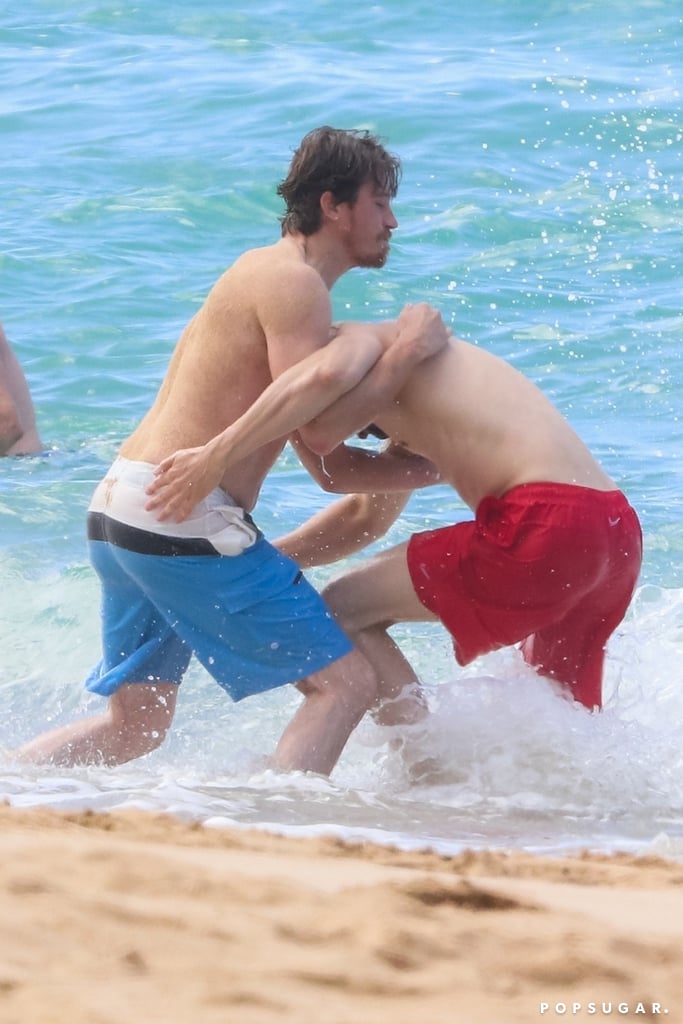 Charlie Hunnam and Garrett Hedlund Wrestle in Hawaii Photos