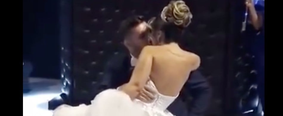 Man in Wheelchair Held Up by Men to Dance With Bride