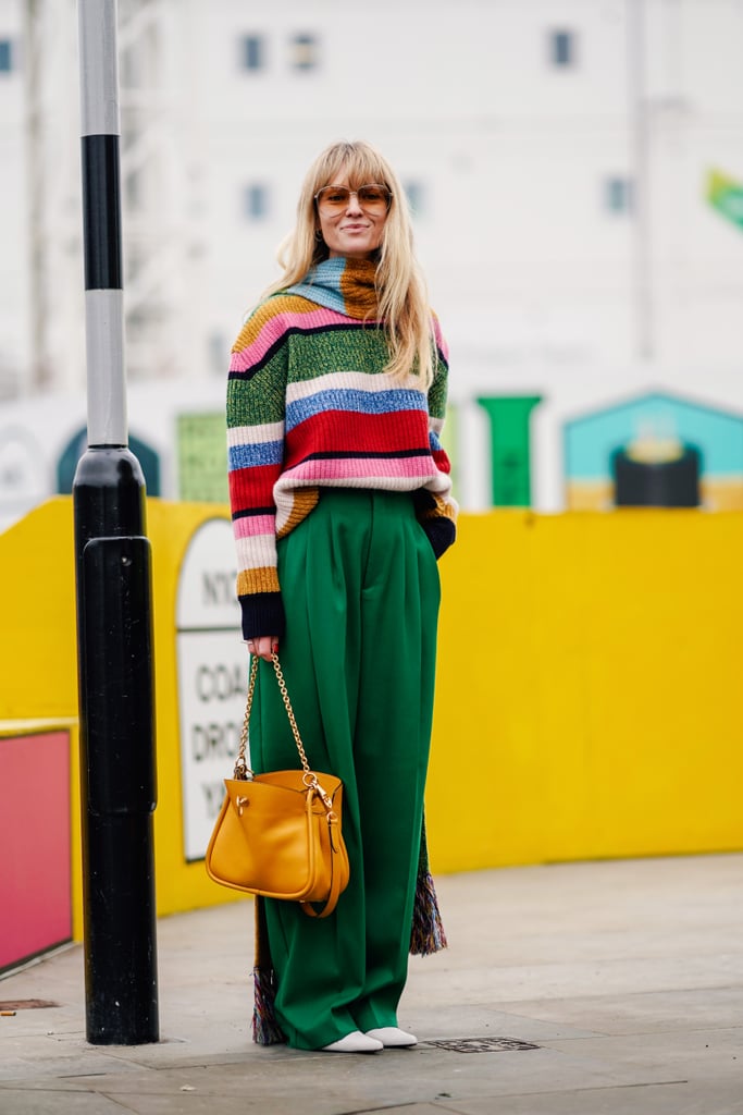 Pick out a colour from a bright, striped sweater and wear it on bottom for a vivid look. Bonus points for a even brighter bag.